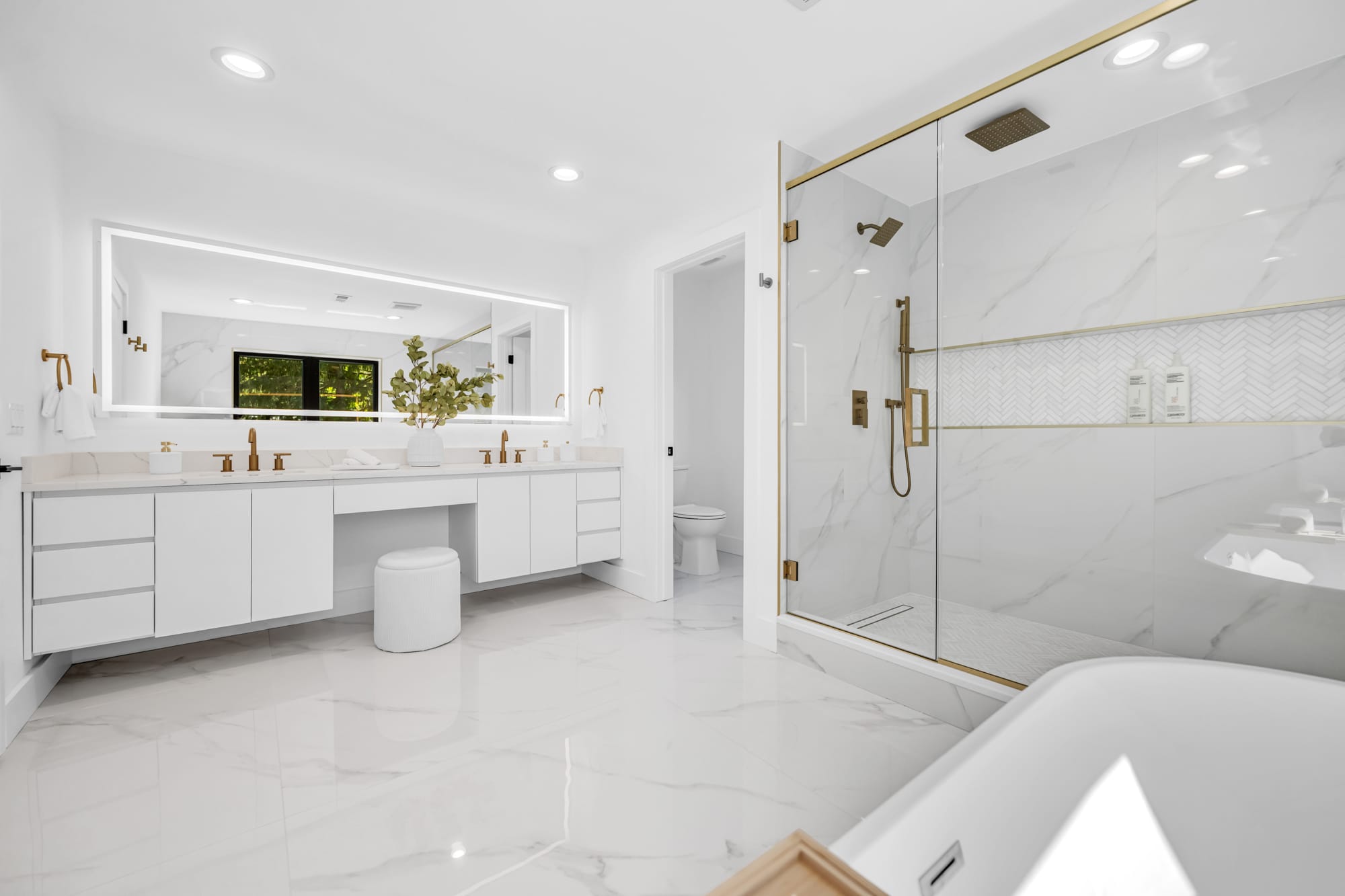 Primary bath renovation, marble and gold finishes — BTA Builders